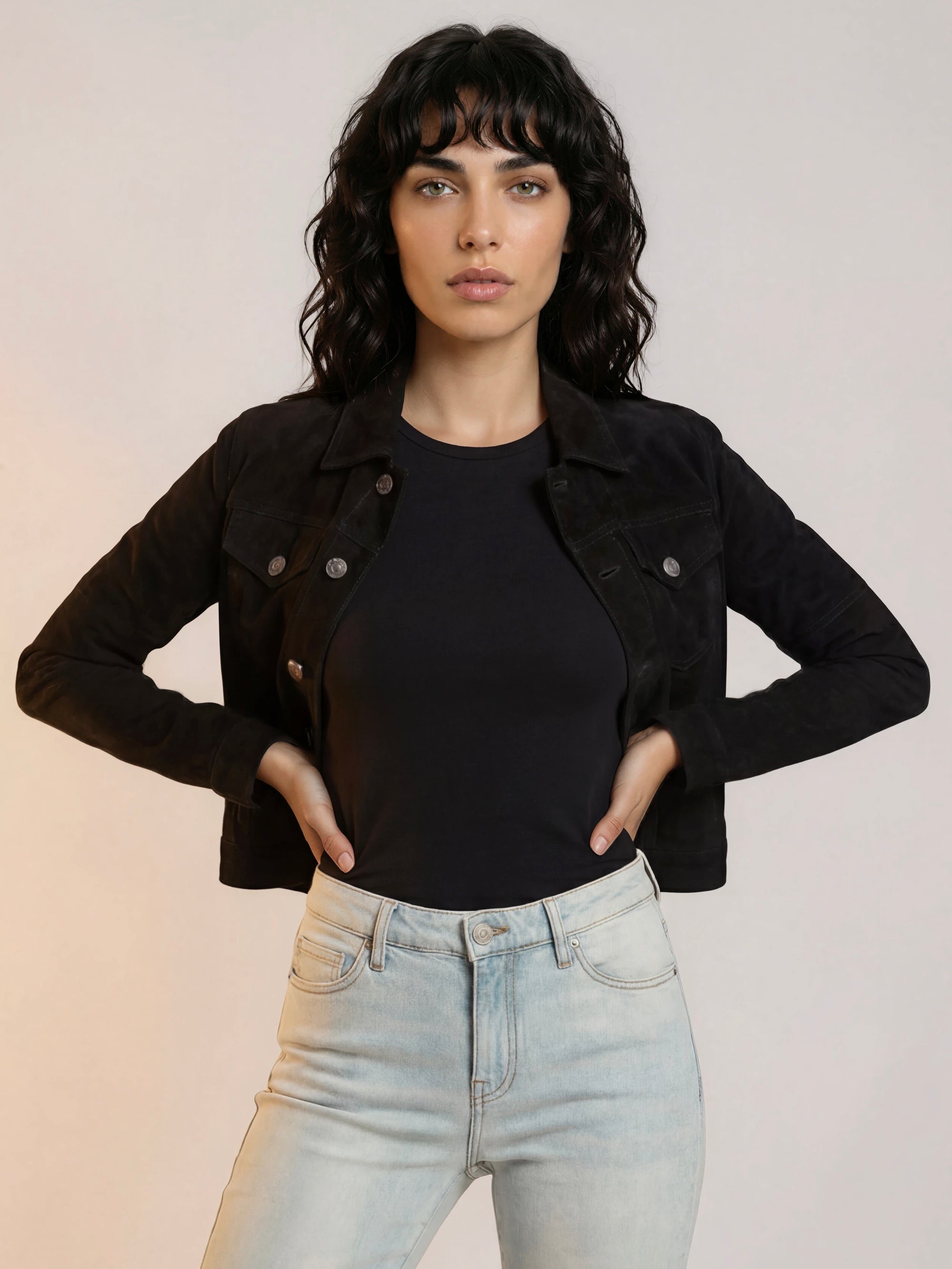 Western cowgirl woman wearing a jet black goat suede trucker jean jacket