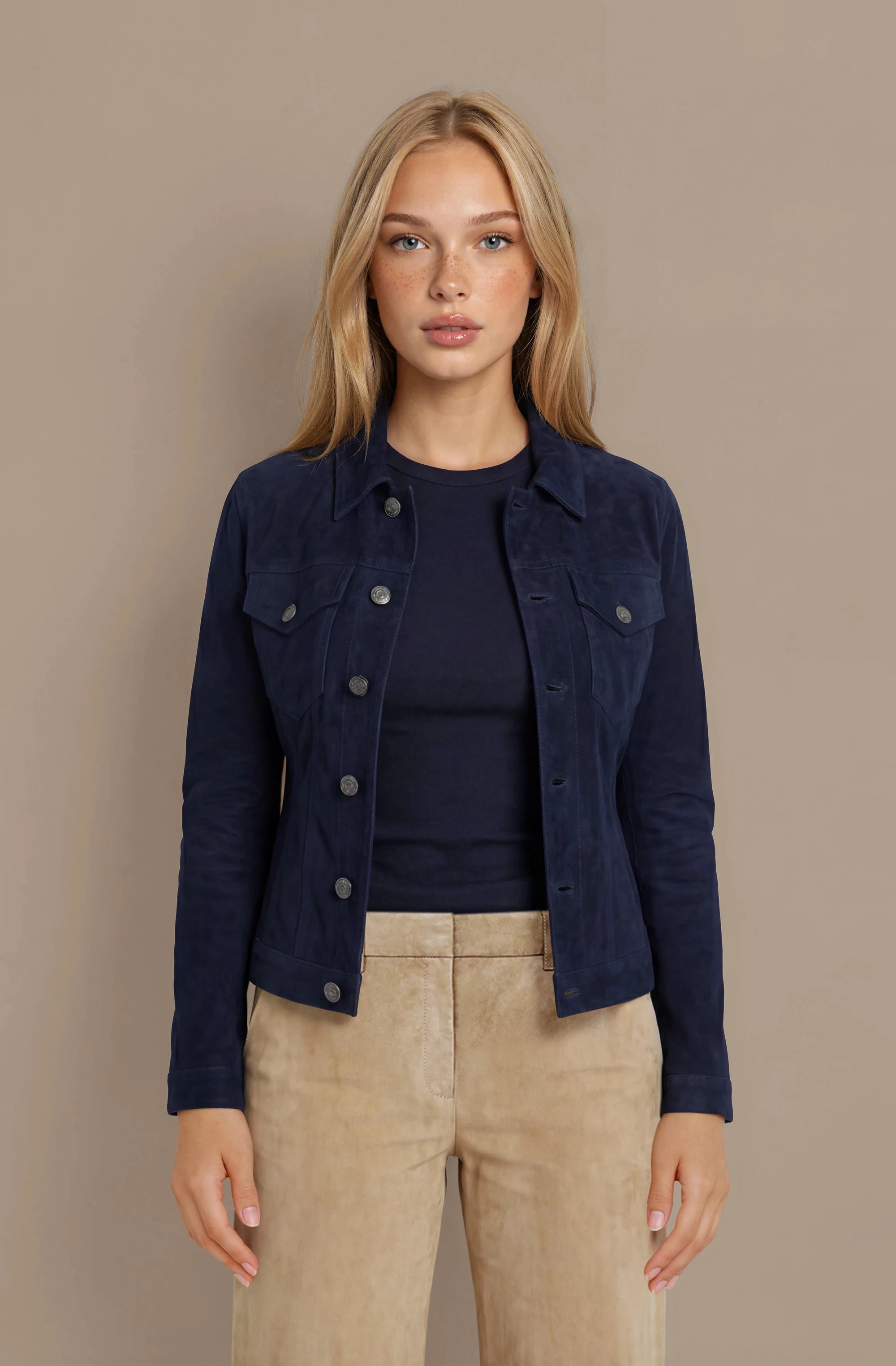 Woman wearing a navy goat suede trucker jacket