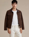 Man wearing a dark brown goat suede trucker jean jacket with snaps