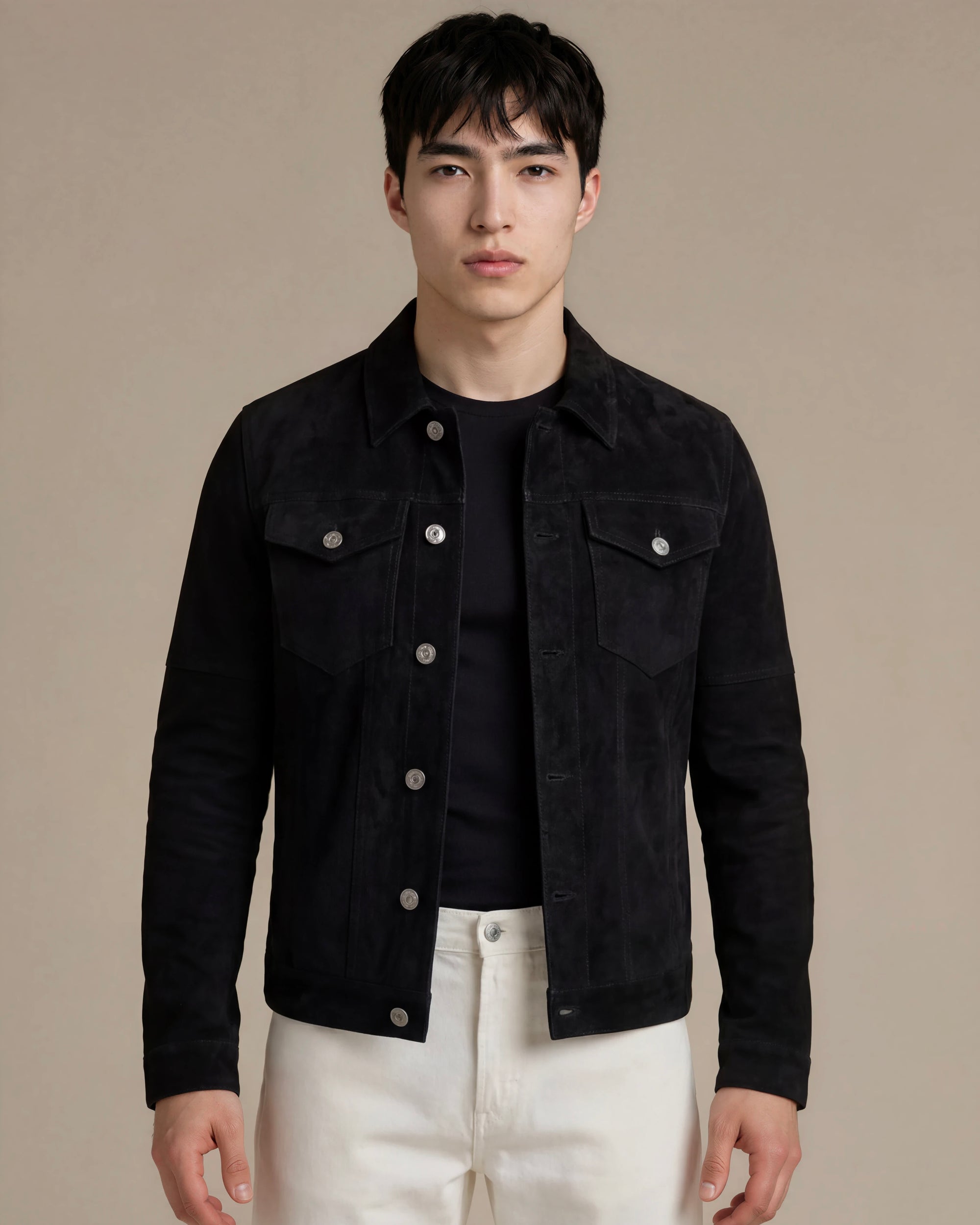 Man wearing a classic jet black goat suede trucker jacket