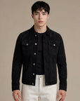 Man wearing a classic jet black goat suede trucker jacket
