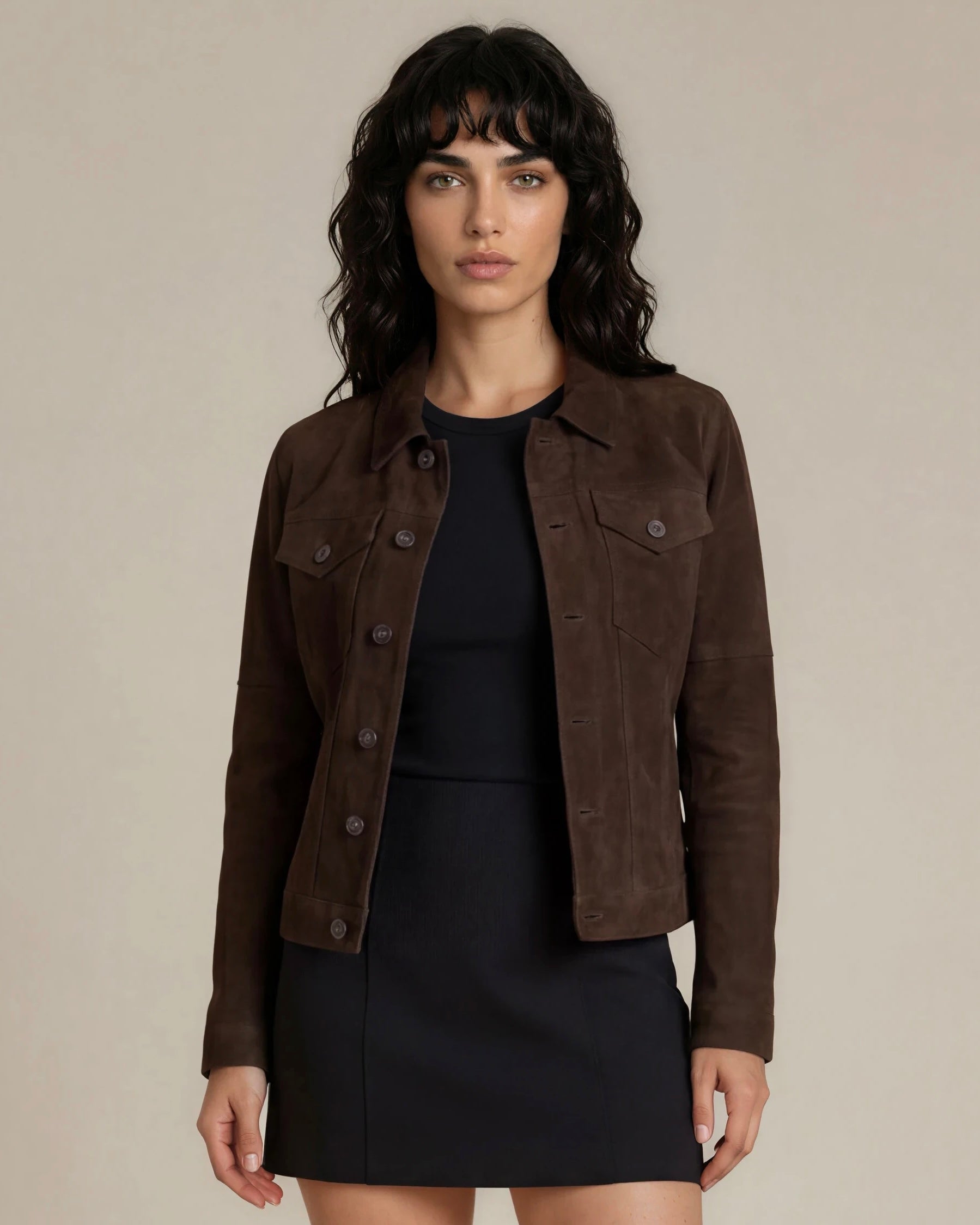 Western cowgirl woman wearing a dark brown goat suede trucker jacket